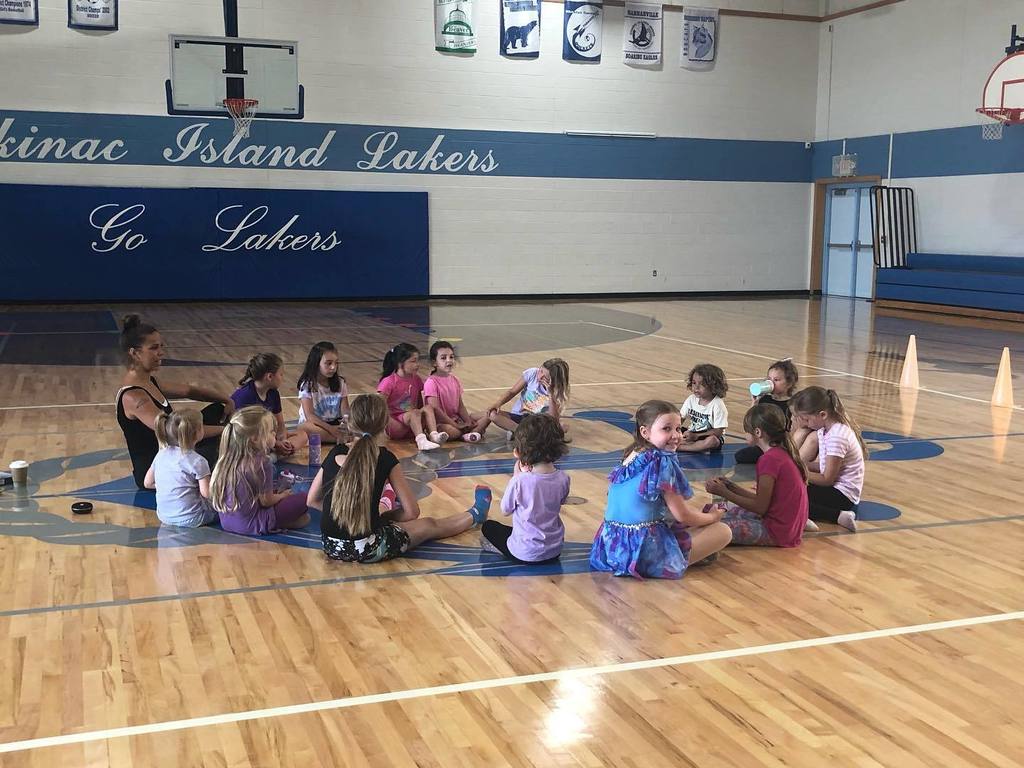 dance students sitting in a circle